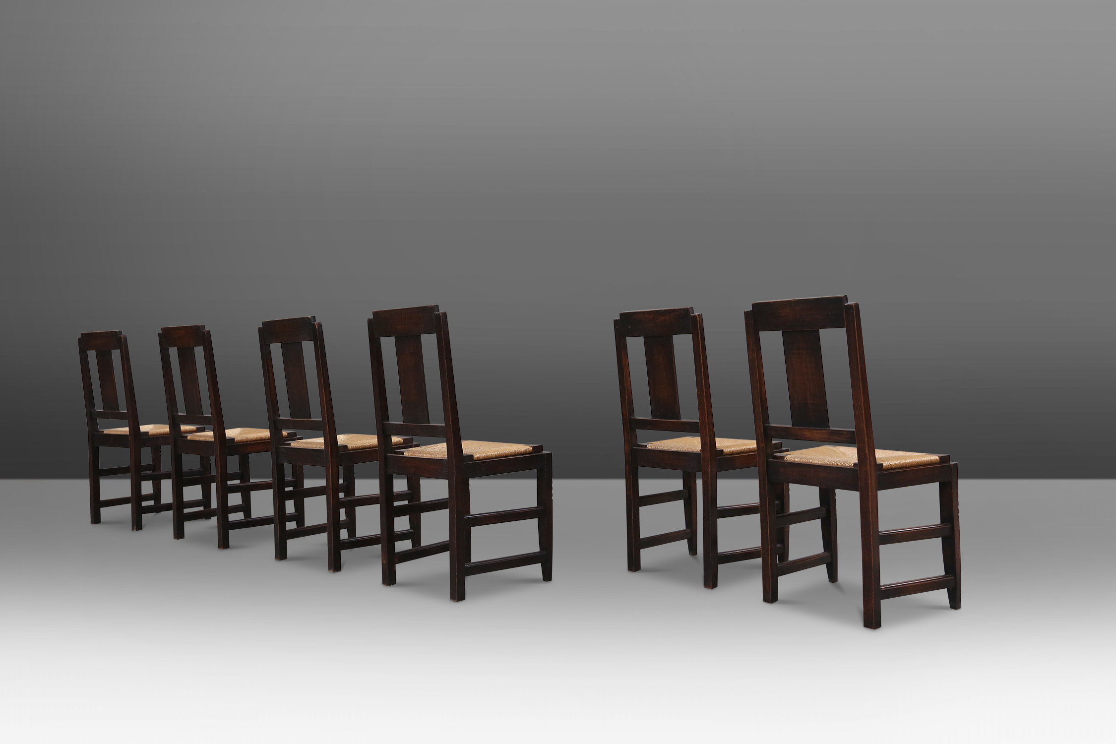 set of oak and wicker dining chairs by Victor Courtray